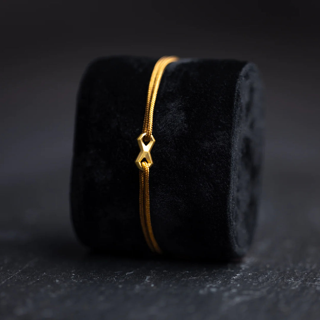 Nylonarmband 1,5 mm, braun, Infinity-Zeichen vergoldet